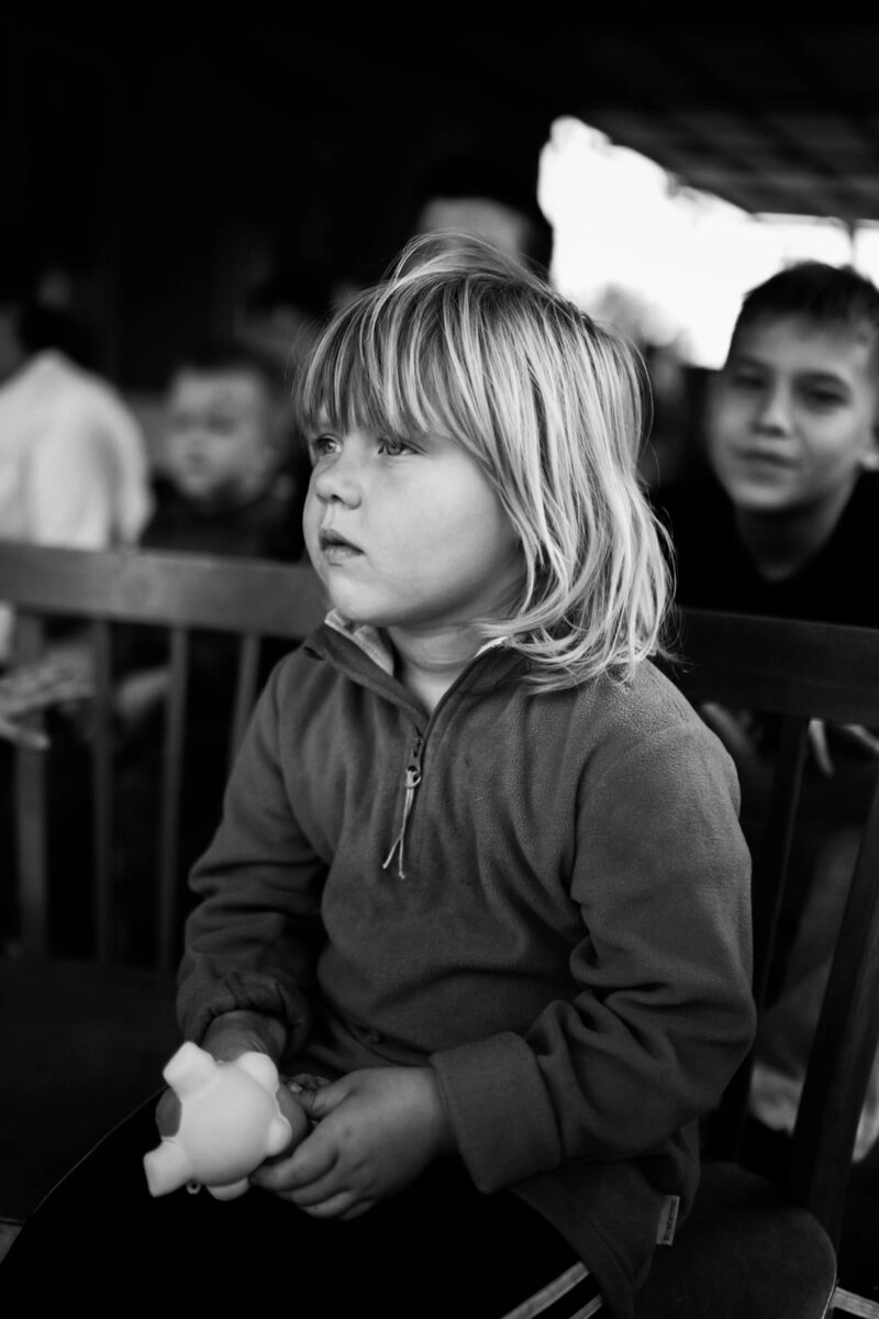 A girl with a toy received from volunteers.
Donetsk region, Ukraine. Autumn 2024.